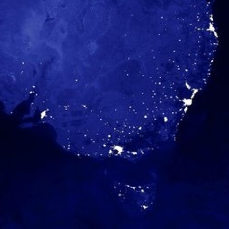 A satellite image of Australia's east coast, showing the lights of the major cities
