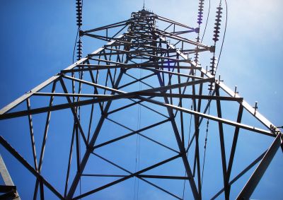 Looking from the group up through the middle of a transmission tower